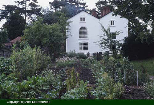 View over vegetable area to herb beds, with Apprentice House beyond - Copyright (c) Alec Scaresbrook