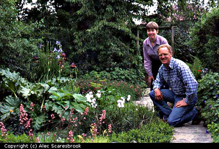 Us by our garden pond.- Copyright (c) Alec Scaresbrook