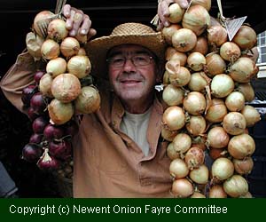 Man with strings of onions photo
